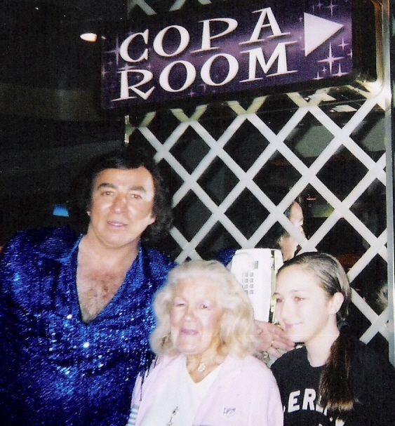 Tom Sadge greets Evelyn, who honored Tom by attending his show at the Sands Copa Room on her 85th birthday! Also pictured is Tom and Marion Sadge's youngest child, Therese, who helps her mom and dad greet audience members after shows. Photo by Marion Sadge