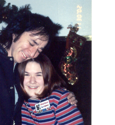 Neil Diamond impersonator Tom Sadge shares a hug and a laugh with a young fan, Helen.